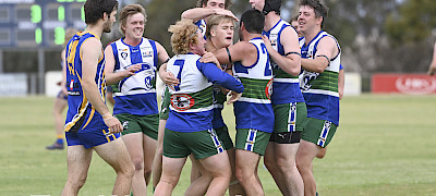 PROUD: Riley Vivian’s Kaniva-Leeor United team-mates congratulate him after kicking a goal in his first senior game. Picture: PAUL CARRACHER