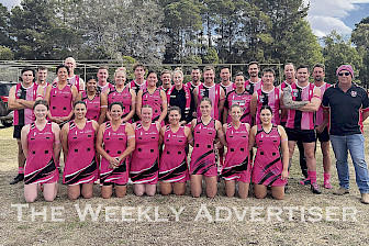 SEA OF PINK: Edenhope-Apsley Football Netball Club’s A- and B-Grade netballers and senior footballers show their support for Breast Cancer Network Australia.