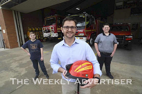 Warracknabeal Fire Brigade captain Cam Whelan with his sons Harrison, 11, and Declan, 15. LIFESTYLE