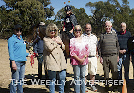 PRESENTATION: Stawell Lions Club, which is calling for new members, recently made a donation towards a new saddle for Riding for the Disabled, Stawell. Jackie Parnell, left, accepts the donation from Graeme Hughes, obscured, Dellwyn Johnson, rider Tanaisha Hornsby, Lions president Marie Hosking, Murray Hosking, Phil Phelan and Max Kennedy, who attended a morning tea at the club.