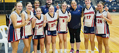 SUCCESS: Horsham’s under-18 girls squad celebrates its grand final victory at the Basketball Victoria Junior Country Championships after an undefeated run.