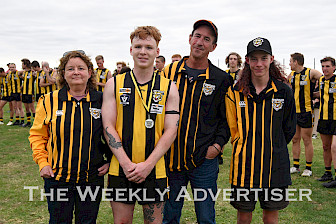 DETERMINED: Dylan Thomas, second from left, was named ‘most determined’ by Trent DeZoete’s family – parents Nicole and Josh, and brother Jamie – during Saturday’s game against Laharum at Pimpinio. Picture: BRONWYN HASTINGS