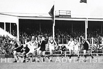 Horsham City Oval grandstand has been a feature of the city’s main sporting showpiece for 100 years. A committee has been formed to mark its centenary and history, such as football matches, above, and how it stands now, below.