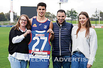 DOGS DEBUT: Horsham’s Joel Freijah, above, with parents Tamara and Gabi, and sister Gemma after being presented with his guernsey to play his first game for the Western Bulldogs.