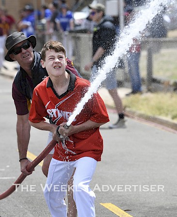 Darren Winsall holds the hose for Declan Holloway, Stawell, at the third round of 2019-20 Wimmera Country Fire Authority Urban Championships at Stawell.