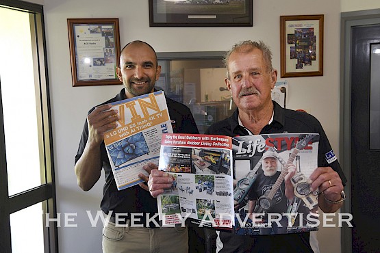 Mark Sulic congratulates Russell Bird for winning at TV in a Lifestyle Wimmera promotion.