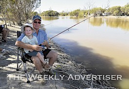 QUALITY TIME: Garry Lamb and grandson Thomas Schneider enjoy some family time during the Jeparit Easter Fishing Competition at the weekend.  Pictures: PAUL CARRACHER