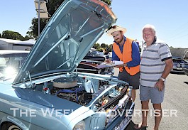 LOOKS GOOD: Robert Briggs’ 1966 Ford Mustang is given the once-over by judge Lachie Kilpatrick at last year’s Great Western Show and Shine Street Party. Picture: PAUL CARRACHER