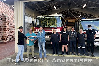 APPRECIATIVE: Dimboola Community Cropping Group’s Ken Ough, left, and Ceus Wolthius present Dimboola Fire Brigade captain Ash Wallace and brigade members with a donation for the new station.