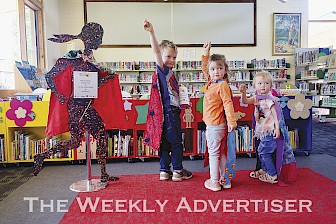 CAPED CRUSADERS: From left, Thomas Argall, Sophie Argall and Jessica Argall show off their Capes 4 Kids Charity capes at Stawell Library.